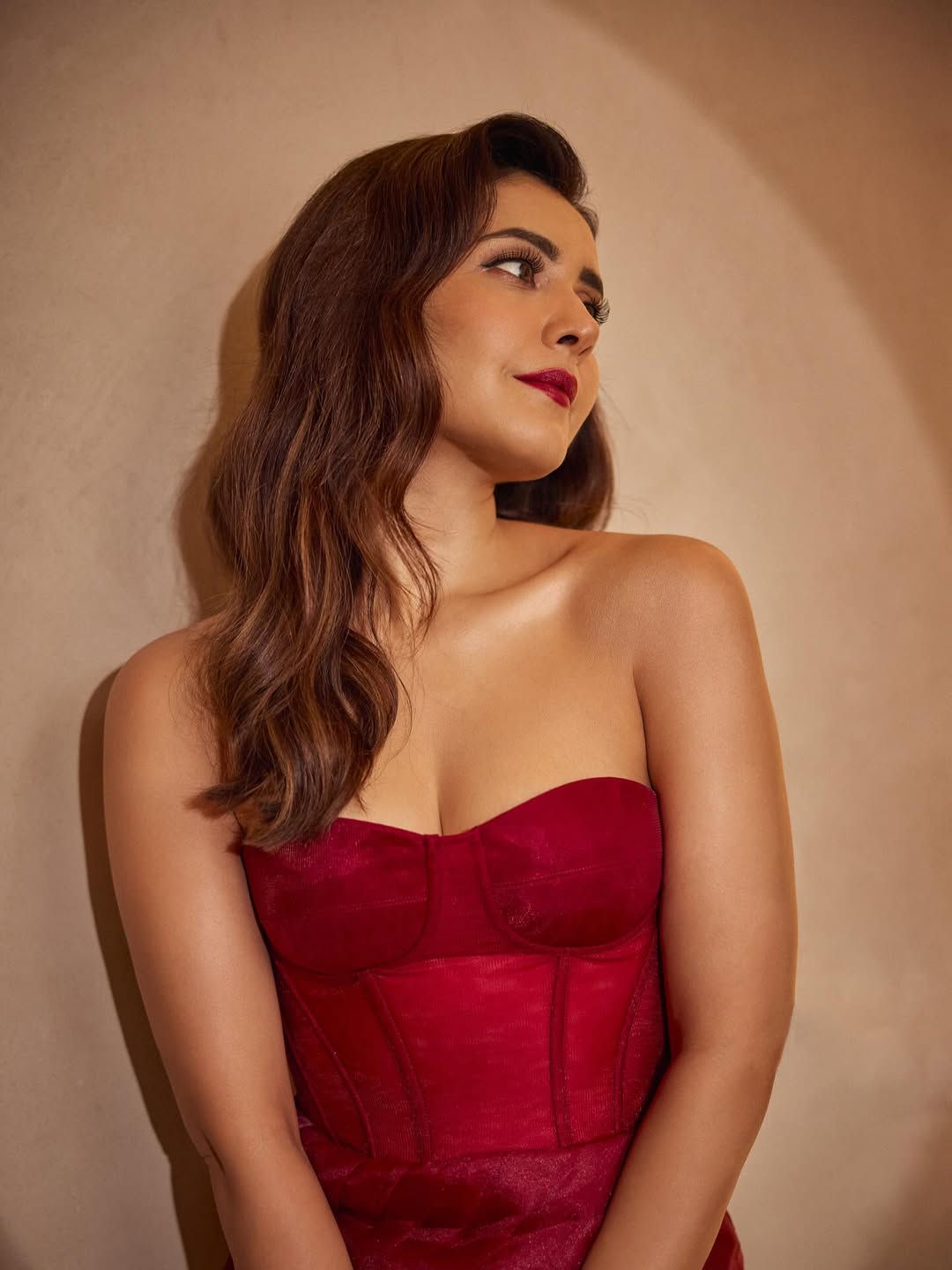 Raashi Khanna in Crimson Dream Gown facing left